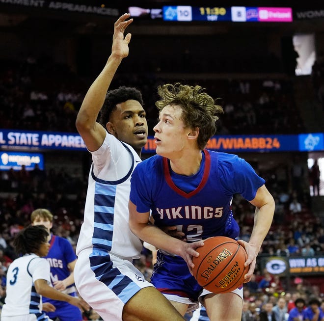 Nicolet's Davion Hannah (25) guards Wisconsin Lutheran's Logan Rindfleisch (12) during the first half of the WIAA Division 2 boys basketball state semifinal game on Friday March 15, 2024 at the Kohl Center in Madison, Wis.