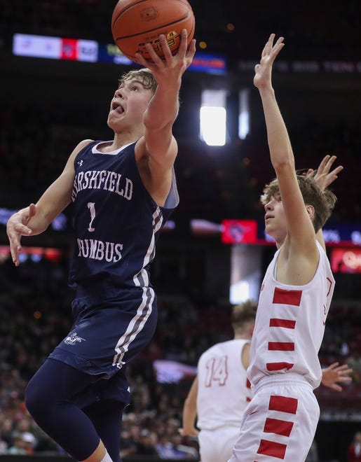 Columbus Catholic High School's Mark Konieczny (1) goes up for a layup against Abundant Life Christian School in the Division 5 state championship game during the WIAA state boys basketball tournament on Saturday, March 16, 2024 at the Kohl Center in Madison, Wis. Columbus Catholic won the game, 81-75.
