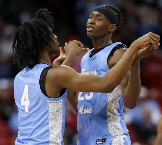St. Thomas More High School's Amari McCottry (4) and Sekou Konneh (25) embrace during a timeout against Lakeside Lutheran High School in the Division 3 state championship game during the WIAA state boys basketball tournament on Saturday, March 16, 2024 at the Kohl Center in Madison, Wis. St. Thomas More won the game, 65-54.
Tork Mason/USA TODAY NETWORK-Wisconsin