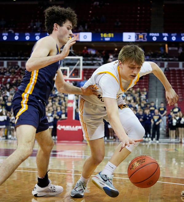 Marquette's Ryan Meehan (24) guards Kettle Moraine's Jack McSorley (1) during the first half of the WIAA Division 1 boys basketball state semifinal game on Friday March 15, 2024 at the Kohl Center in Madison, Wis.