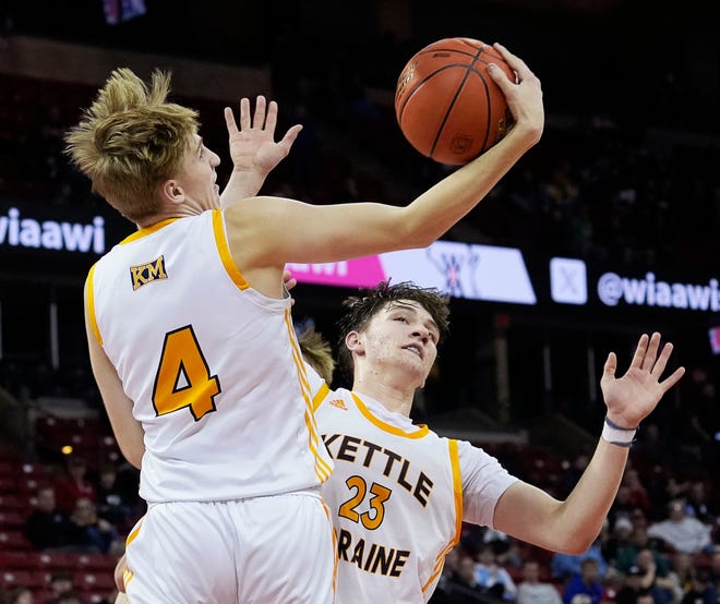 Kettle Moraine's Zach Froemming (4) catches the rebound during the second half of the WIAA Division 1 boys basketball state semifinal game against Marquette on Friday March 15, 2024 at the Kohl Center in Madison, Wis.