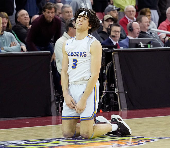 Kenosha St. Joseph's Eric Kenesie (3) falls to the floor as Kenosha St. Joseph is defeated by Mineral Point in the WIAA Division 4 boys basketball state championship game on Saturday March 16, 2024 at the Kohl Center in Madison, Wis.