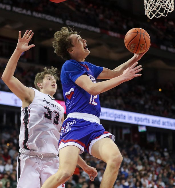 Wisconsin Lutheran High School's Logan Rindfleisch (12) goes up for a reverse layup against Pewaukee High School in the Division 2 state championship game during the WIAA state boys basketball tournament on Saturday, March 16, 2024 at the Kohl Center in Madison, Wis. 
Tork Mason/USA TODAY NETWORK-Wisconsin