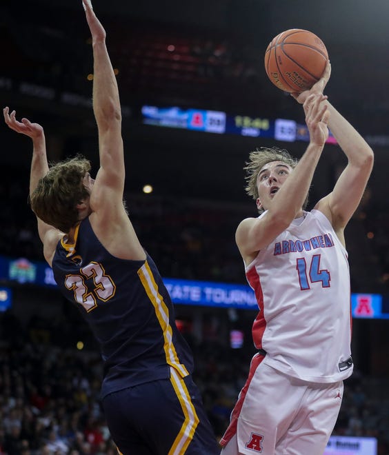 Arrowhead High School's Bennett Basich (14) puts up a shot against Marquette University High School in the Division 1 state championship game during the WIAA state boys basketball tournament on Saturday, March 16, 2024 at the Kohl Center in Madison, Wis. Marquette won the game, 84-62.