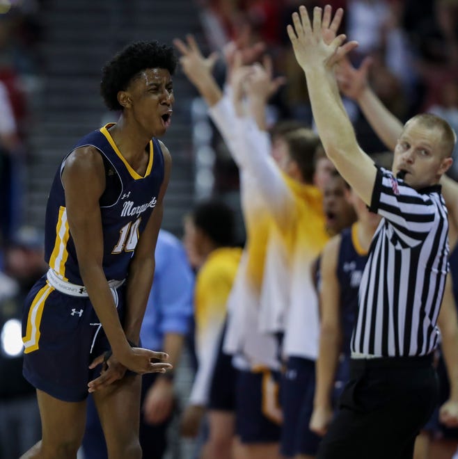 Marquette University High School's Jeremiah Johnson (10) reacts after hitting a 3-pointer against Arrowhead High School in the Division 1 state championship game during the WIAA state boys basketball tournament on Saturday, March 16, 2024 at the Kohl Center in Madison, Wis. Marquette won the game, 84-62.