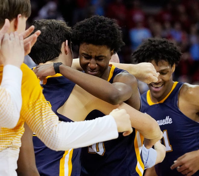 Marquette's Jeremiah Johnson (10) is emotional as he is substituted out as Marquette leads in the WIAA Division 1 boys basketball state championship game against Arrowhead on Saturday March 16, 2024 at the Kohl Center in Madison, Wis.