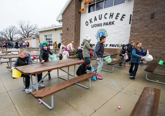 Youngsters gather candy-filled eggs during the annual Okauchee Lions Easter Egg Hunt at Lions Park on Saturday, March 30, 2024. The free family event, hosted by the Okauchee Lions Club, features several egg hunts for various age groups.