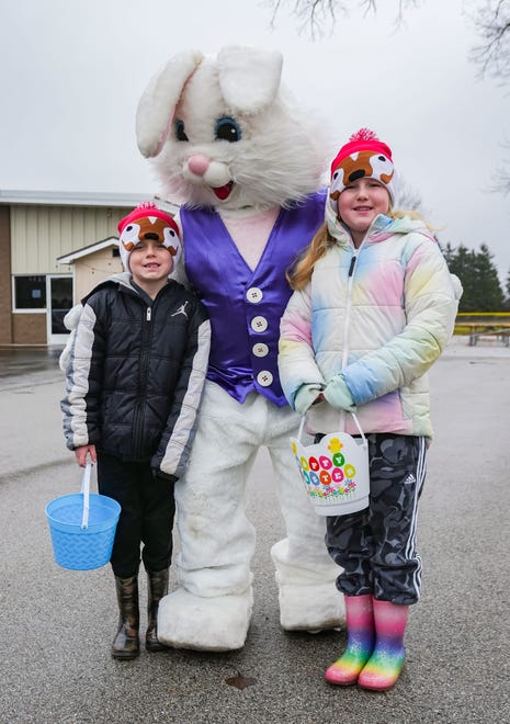 Keegan, 6, and Kaylynn Parker, 9, of Hartland, pose for a photo with the Easter Bunny prior to the annual Okauchee Lions Easter Egg Hunt at Lions Park on Saturday, March 30, 2024. The free family event is hosted by the Okauchee Lions Club.