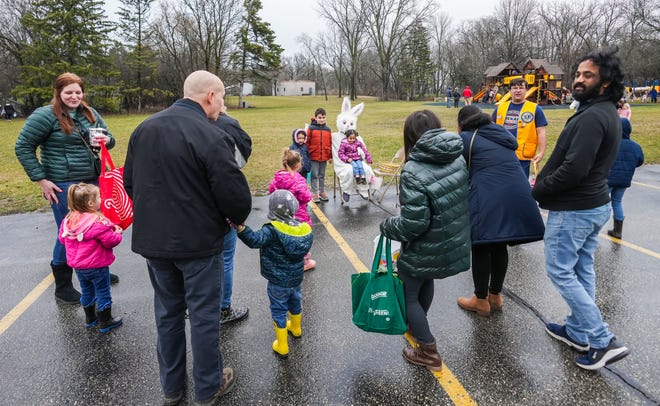 Families gather for photos with the Easter Bunny during the annual Okauchee Lions Easter Egg Hunt at Lions Park on Saturday, March 30, 2024. The free family event is hosted by the Okauchee Lions Club.