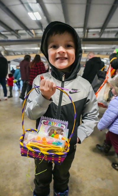 Lincoln Fassbender, 6, of Oconomowoc, takes home a special prize basket after finding one of the rare golden eggs during the annual Okauchee Lions Easter Egg Hunt at Lions Park on Saturday, March 30, 2024. The free family event is hosted by the Okauchee Lions Club.