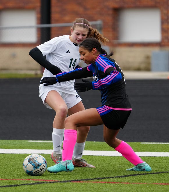 Waukesha West's Mariah Carter (5) gets past Kettle Moraine Lutheran's Ava Walz (14) during the match at Waukesha West on Saturday, March 30, 2024.