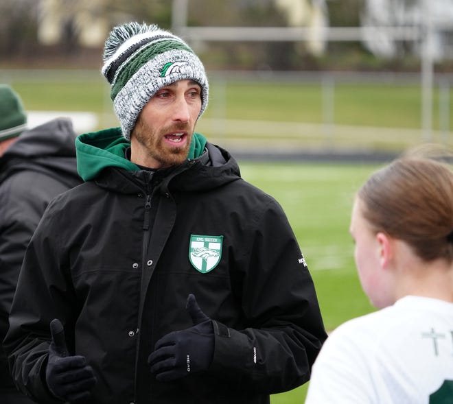 Kettle Moraine Lutheran head coach Mark Nolte talks with players during the match at Waukesha West on Saturday, March 30, 2024. Kettle Moraine Lutheran won 4-2.