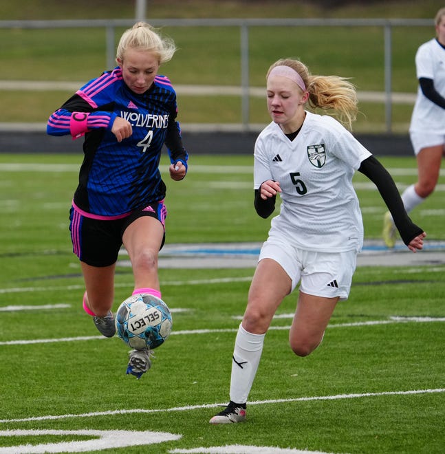 Waukesha West's Megan Thomsen (4) races Kettle Moraine Lutheran's Lauryn Haines (5) downfield in the match at Waukesha West on Saturday, March 30, 2024.