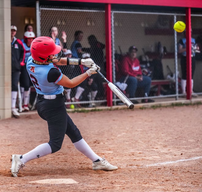 Arrowhead's Stella Peterson (2) connects for a sacrifice fly to right field during the game at home against Oconomowoc, Tuesday, April 16, 2024.