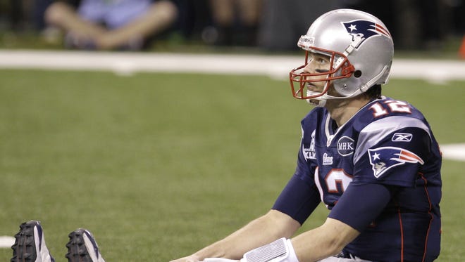 Brady sits on the field during the Patriots loss to the Giants in Super Bowl XLVI.