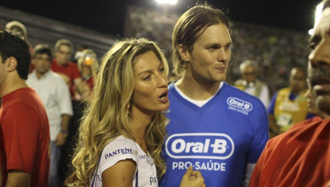Brady with his wife, Brazilian supermodel Gisele Bundchen, at Carnival in Rio de Janeiro in 2011.