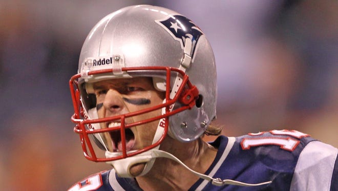 Brady reacts after a Patriots score in Super Bowl XLVI.