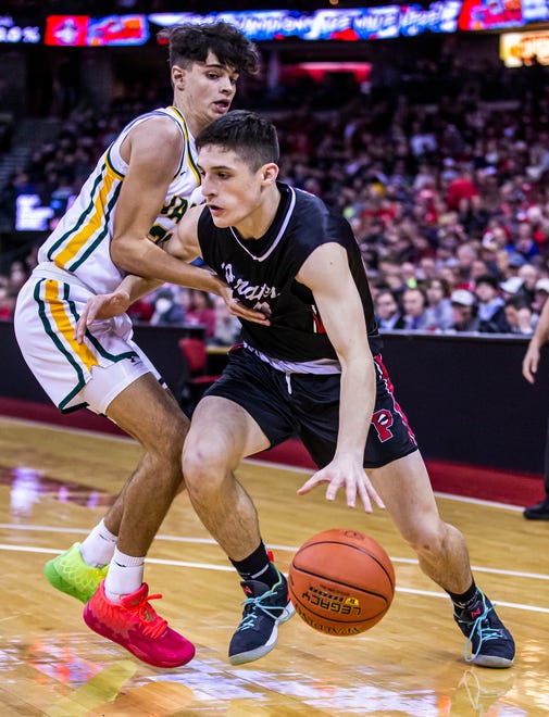 Pewaukee's Nick Janowski (23) breaks past Ashwaubenon's Jayden Schoen (22) defending during the WIAA Division 2 state boys basketball semifinal at the Kohl Center in Madison on Friday, March 18, 2022.
