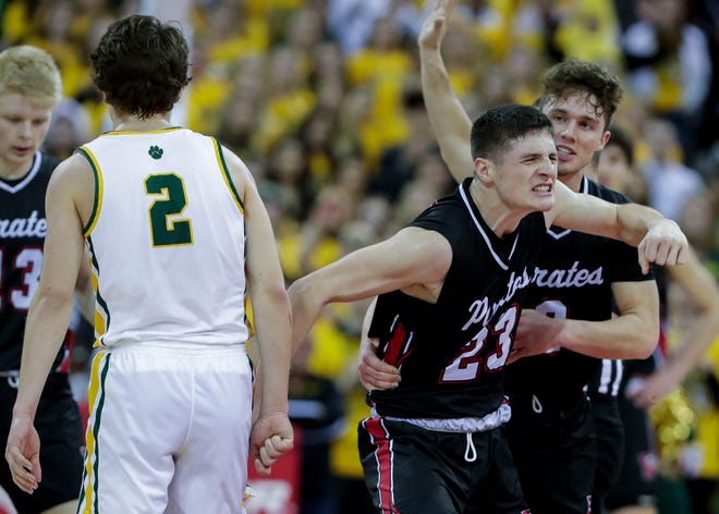 Pewaukee High School's Nick Janowski (23) reacts after tying up a loose ball against Ashwaubenon High School during a WIAA Division 2 state semifinal boys basketball game on Friday, March 18, 2022, at the Kohl Center in Madison, Wis. Pewaukee won the game, 60-49.
Tork Mason/USA TODAY NETWORK-Wisconsin