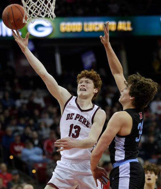 De Pere High School's Will Hornseth (13) against Arrowhead High School's Garrett Sexton (34) during their WIAA Division 1 state championship boys basketball game on Saturday, March 18, 2023 at the Kohl Center in Madison, Wis. De Dere won the game 69-49 to finish the season a perfect 30-0.
Wm. Glasheen USA TODAY NETWORK-Wisconsin