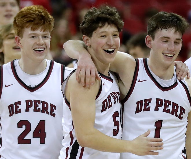 De Pere High School's Ethan Ramos (24), Caleb Dietsche (5) and John Kinziger (1) celebrate their victory over   Arrowhead High School during their WIAA Division 1 state championship boys basketball game on Saturday, March 18, 2023 at the Kohl Center in Madison, Wis. De Dere won the game 69-49 to finish the season a perfect 30-0.
Wm. Glasheen USA TODAY NETWORK-Wisconsin