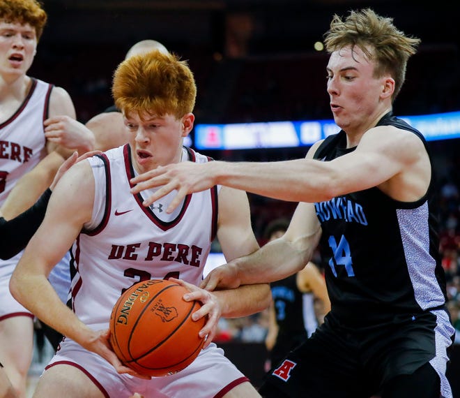 De Pere High School's Ethan Ramos (24) is fouled by Arrowhead High School's Bennett Basich (14) during the WIAA Division 1 boys basketball state championship game on Saturday, March 18, 2023, at the Kohl Center in Madison, Wis. De Pere won the game, 69-49, to finish the season a perfect 30-0.
Tork Mason/USA TODAY NETWORK-Wisconsin