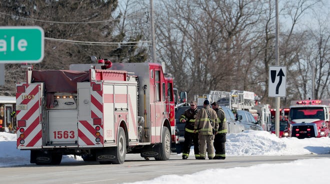 Emergency personnel respond to a fire that  injured two people and substantially damaged a town of Waukesha home at S15 W22398 Arcadian Ave. in the Town of Waukesha on Tuesday, Feb. 19, 2019.