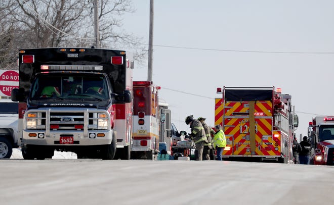 Emergency personnel respond to a fire that  injured two people and substantially damaged a town of Waukesha home at S15 W22398 Arcadian Ave. in the Town of Waukesha on Tuesday, Feb. 19, 2019.