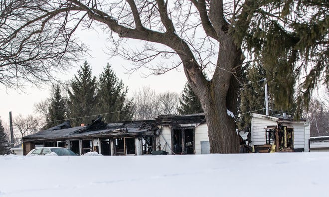 A charred shell is all that remains from a fatal town of Waukesha house fire at S15 W22398 Arcadian Ave. on Tuesday, Feb. 19, 2019. The early morning blaze killed three occupants and injured three others.